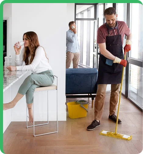 worker cleanign an area while the the family rests
