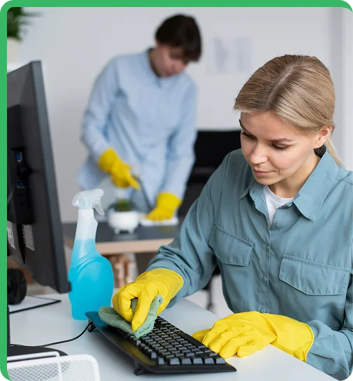 worker performing cleaning on a computer in Office